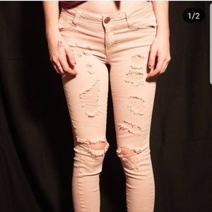 Light pink distressed skinny jeans